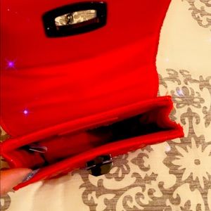 5x5 red purse for an evening out. Fits a phone, some make up and your keys.